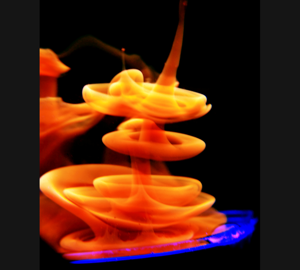 Dyed mineral oil injected into clear mineral oil forms layers of vortex