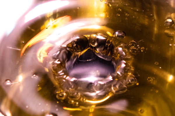 water droplets through olive oil.